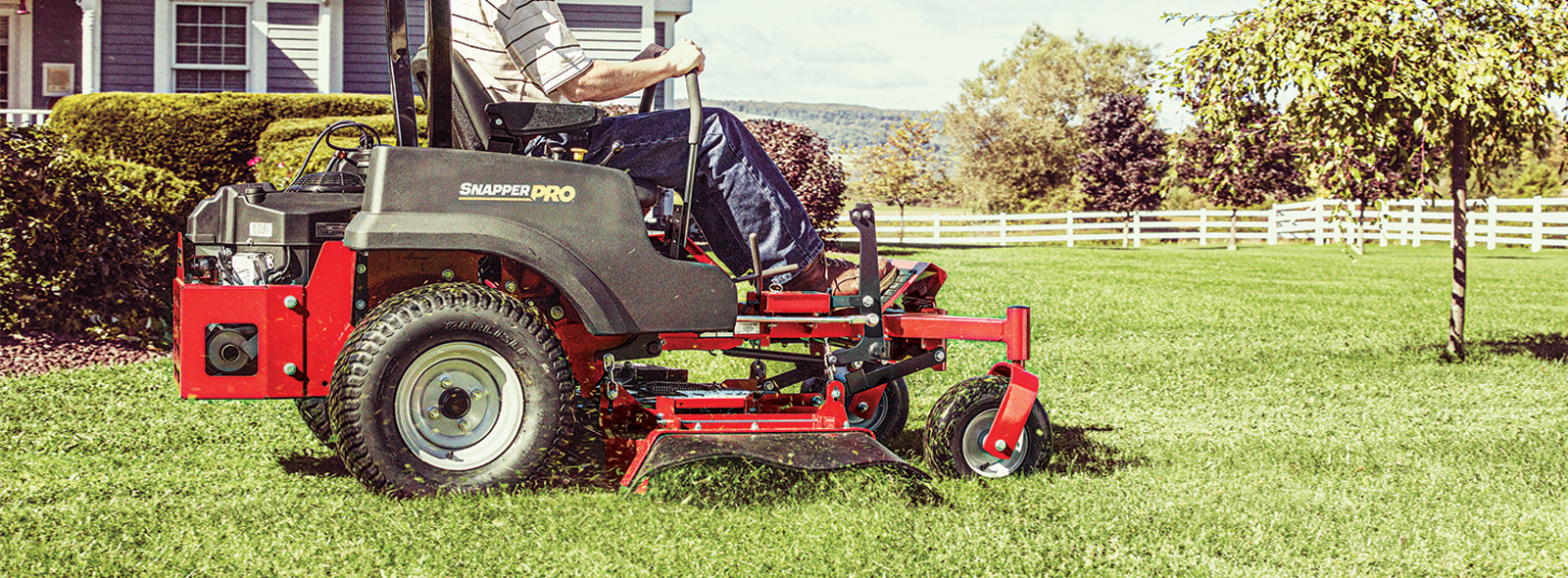 Man cutting grass with Snapper Pro zero turn mower