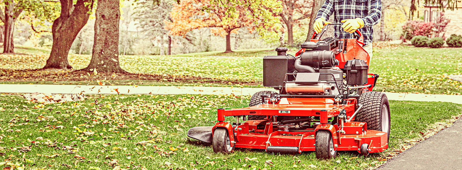 Man using a Snapper Pro Walk Behind Mower